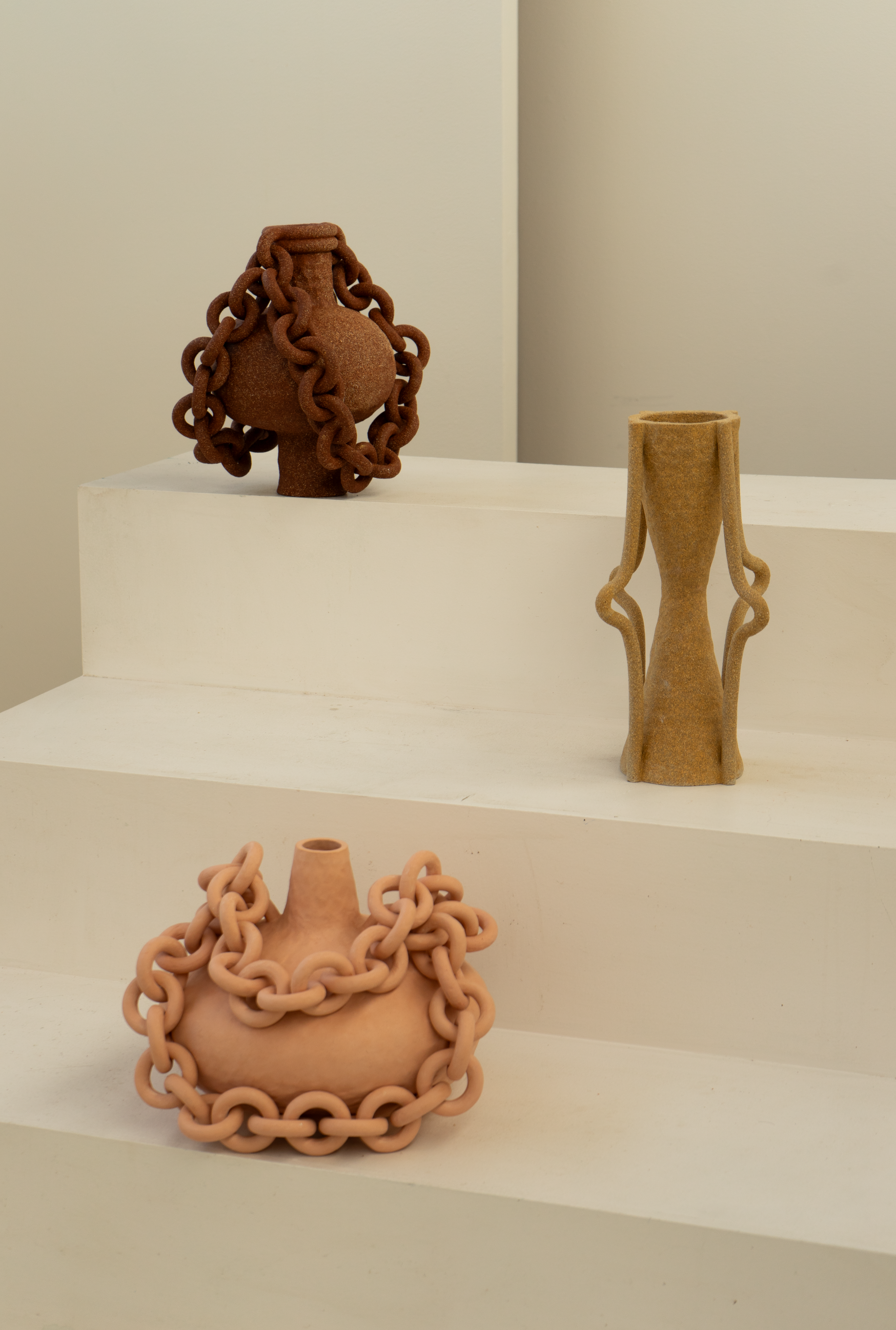 Three 2024 ceramic chained vessels by Sharpe, 14 x 14 x 14 in. (top), 16 x 10 x 8 in. (middle), 16 x 16 x 16 in. (bottom). Photo by Whitney Sharpe.