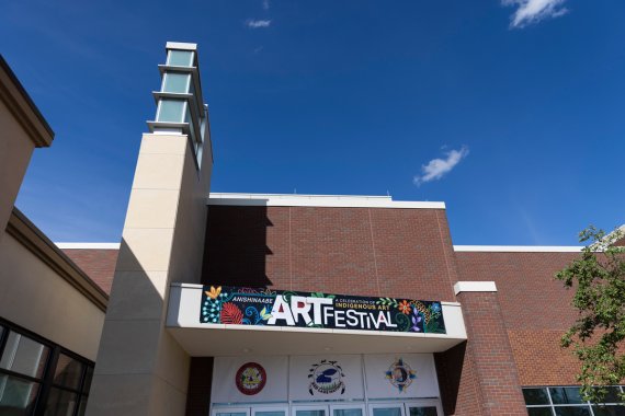 front entrance of an event center with art festival banner above the doors