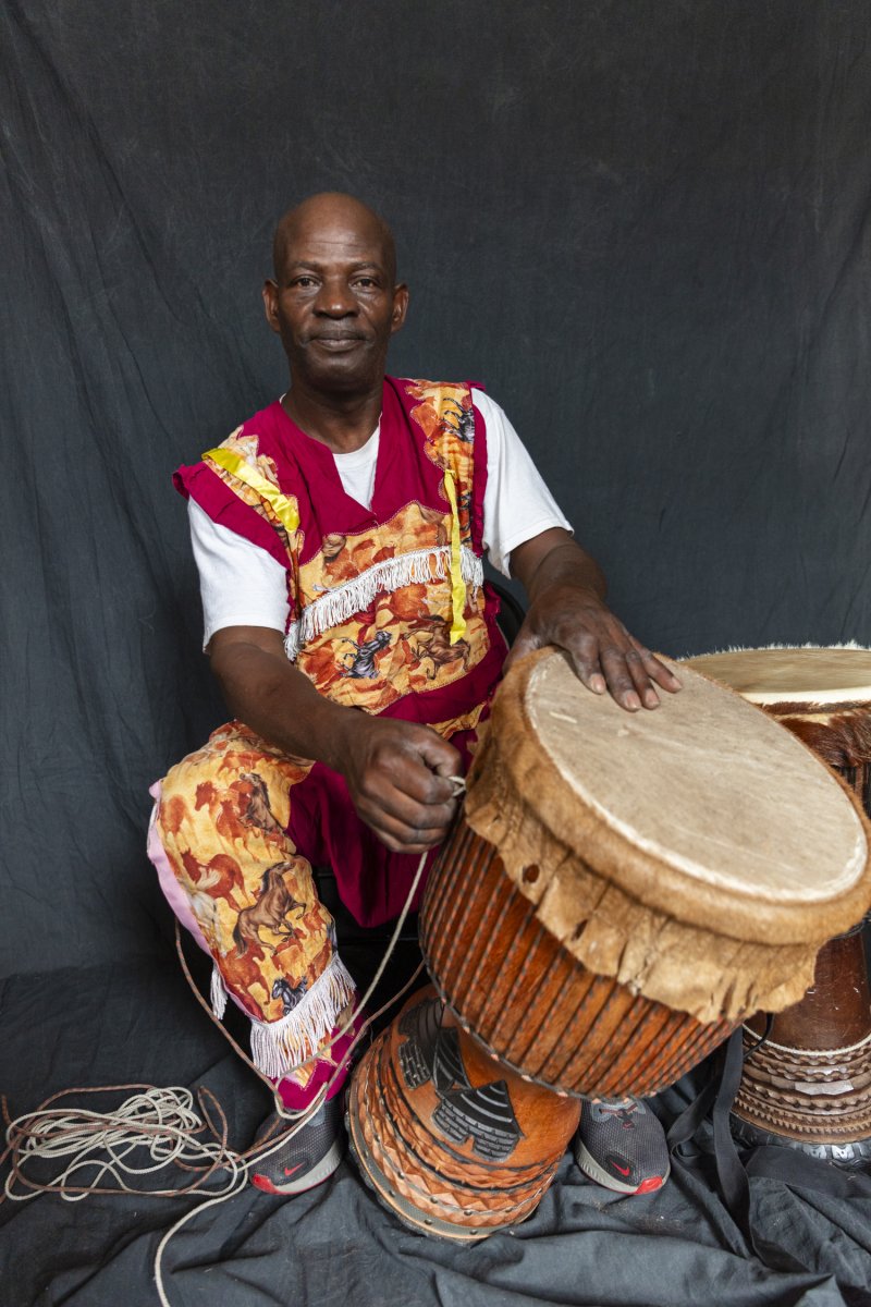 Koné with his handmade drums. Photo by Cedric Angeles.