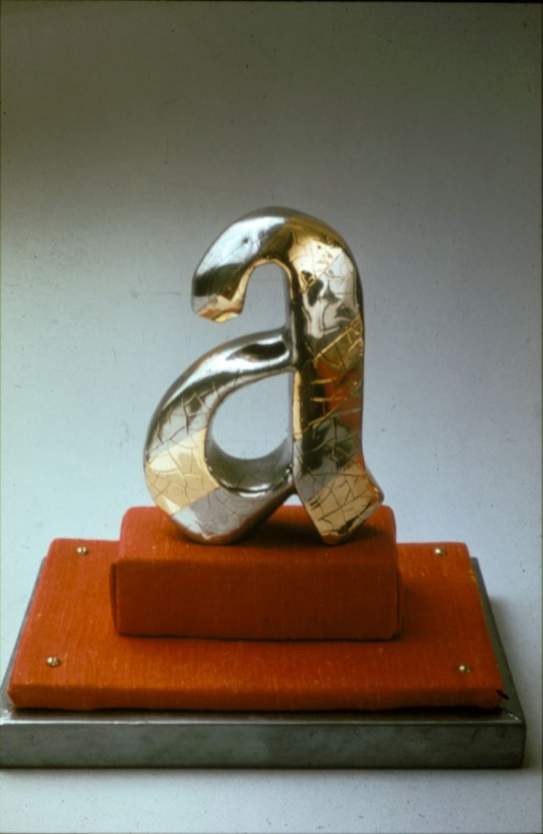 Jim Melchert’s work titled Precious ‘A’ II, 1969, earthenware, glazes, lustres, 7 inches high.