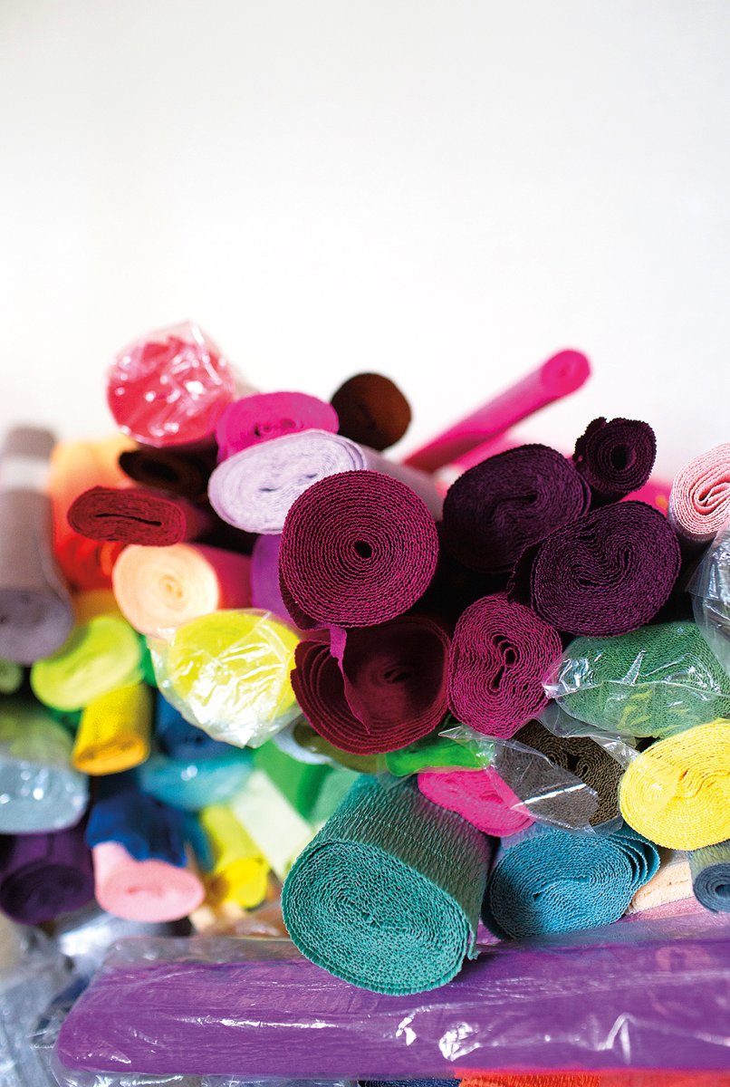 The artist’s rolls of crepe paper are made in Italy, reflecting the cultural journey of the piñata.