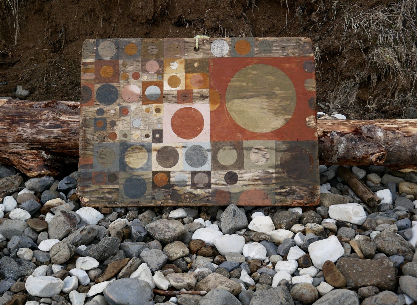 Mineral pigments found and prepared on-site, flotsam driftwood by Tilke Elkins.