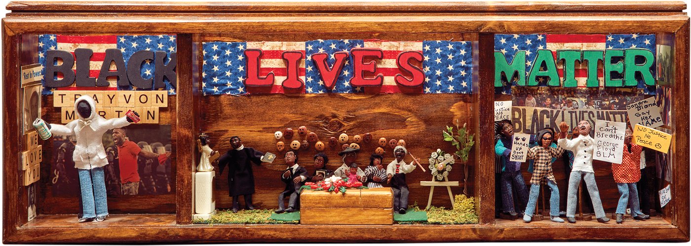 Diorama of people with protesting signs and Black Lives Matter words.