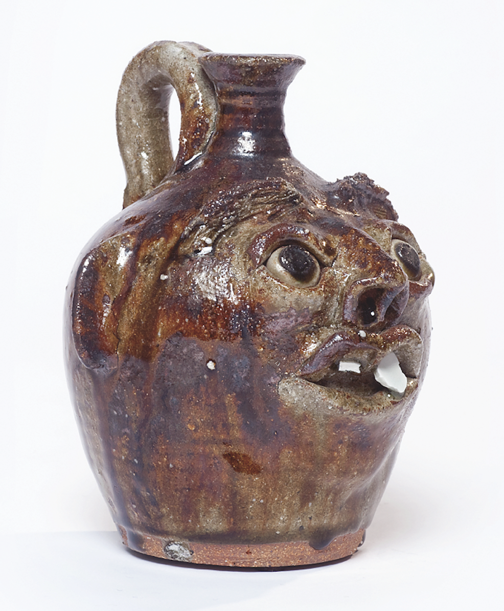 Jug with a face.