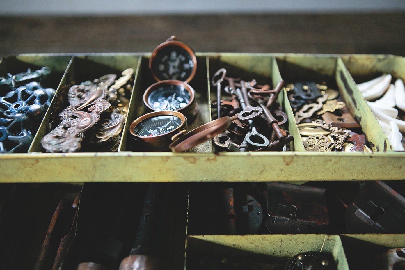An antique metal toolbox contains closure components and binding tools. Photo by Kelley Schuyler.