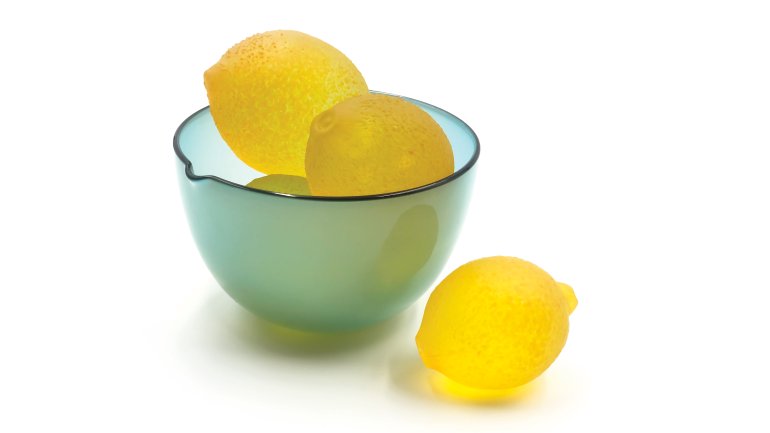 Glass lemons in a glass bowl