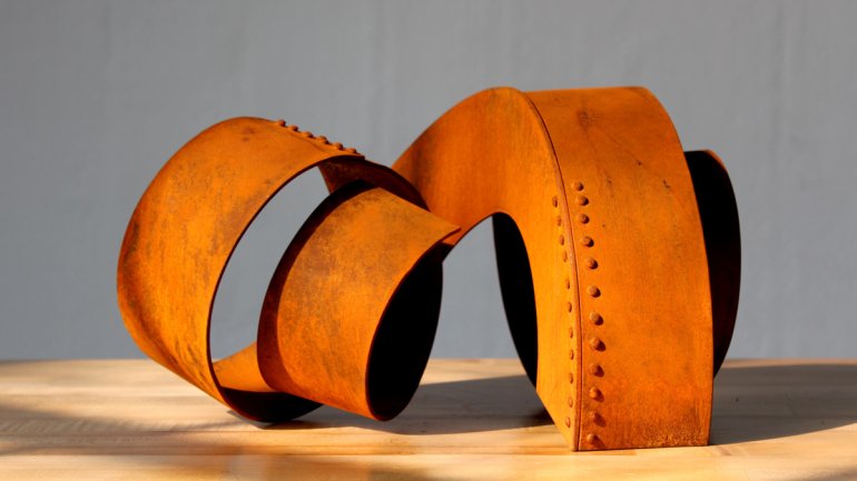 Orange metal coil sculpture