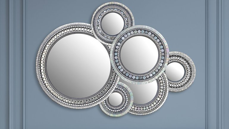 collage of overlapping round mirrors of different sizes with ornate mosaic frames