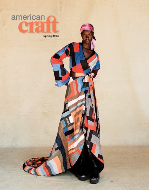 cover of american craft magazine featuring a model wearing a pink silk headscarf and an orange blue black and white patchwork robe