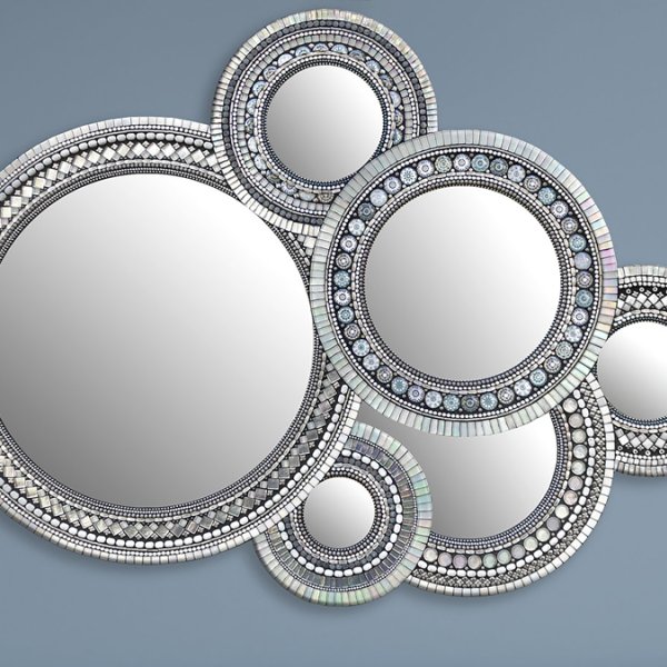 collage of overlapping round mirrors of different sizes with ornate mosaic frames