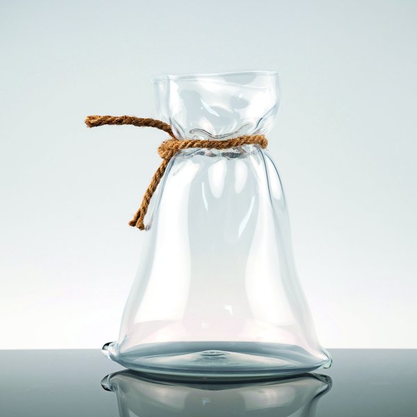 Glass jar with a rope tied around it - appears to look like a bag.