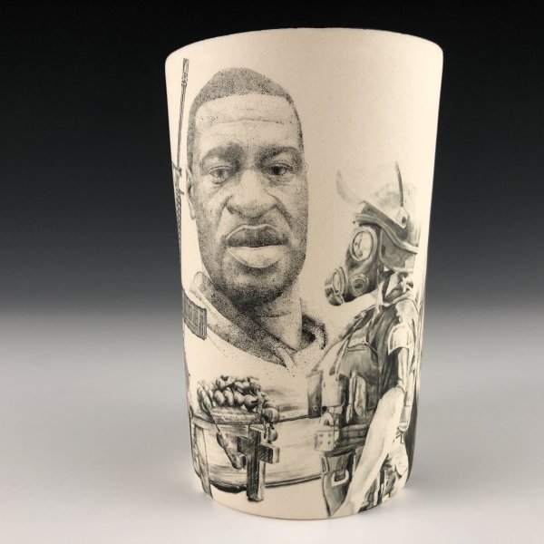 Hand-painted porcelain cup with imagery of George Floyd and a person in a gas mask.