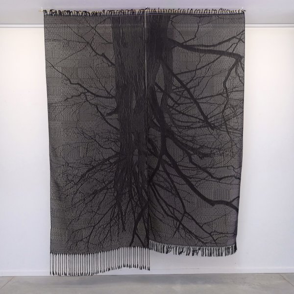 Tali Weinberg, Lungs, 2022, plant fibers, petrochemical-derived dyes and monofilament handwoven on a TC2 digital jacquard loom, 112 x 86 in., installed at Dreamsong Gallery in Minneapolis as part of the project Memories of Future Fires. Photo by Rebecca Heidenberg.