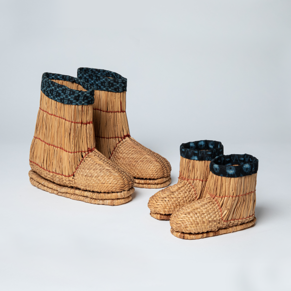 These zunbe (straw boots), also a part of Over/Under, date to 20th-century Japan and are woven from palm leaves, 9 x 3.5 x 9.5 in. (left) and 4.5 x 3 x 6 in. (right). Photo courtesy of Mingei International Museum.