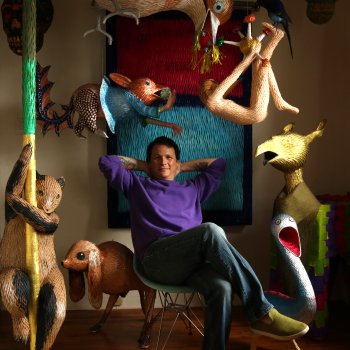 Roberto Benavidez with some of his piñata creations in his Los Angeles home studio. Photo by Roberto Benavidez.