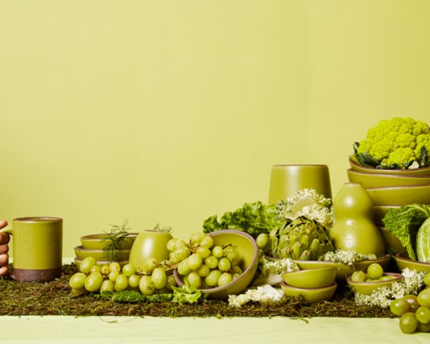 Spread of East Fork Pottery wares with various green fruits and vegetables