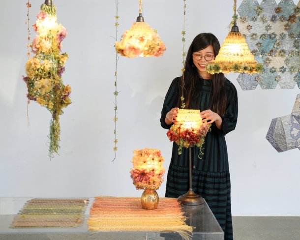 Artist Yi Hsuan Sung with lampshades made from agar