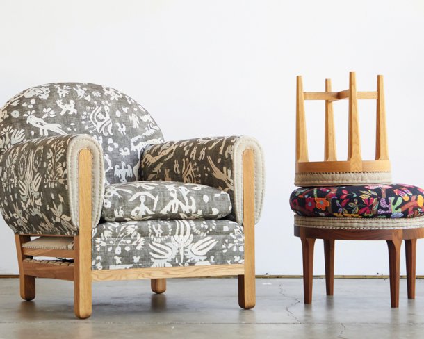 set of three handmade furniture pieces made with traditional upholstery techniques—a club chair and an ottoman with a stool stacked on top of it