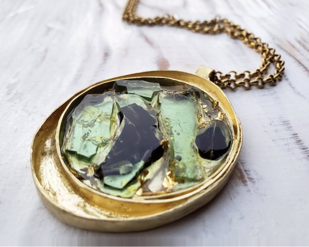 handmade gold necklace inlaid with fragments of a shattered car window